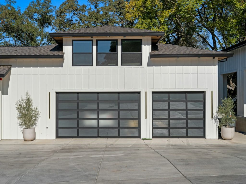 Full-view garage doors on a board-and-batten home